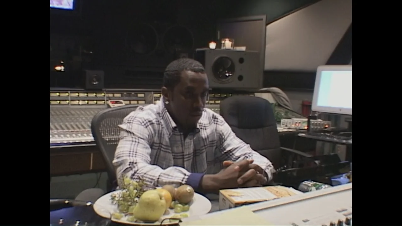 Mary J. Blige's My Life (2021) movie still: medium — A professional recording studio features a large mixing board and computer screens in the…