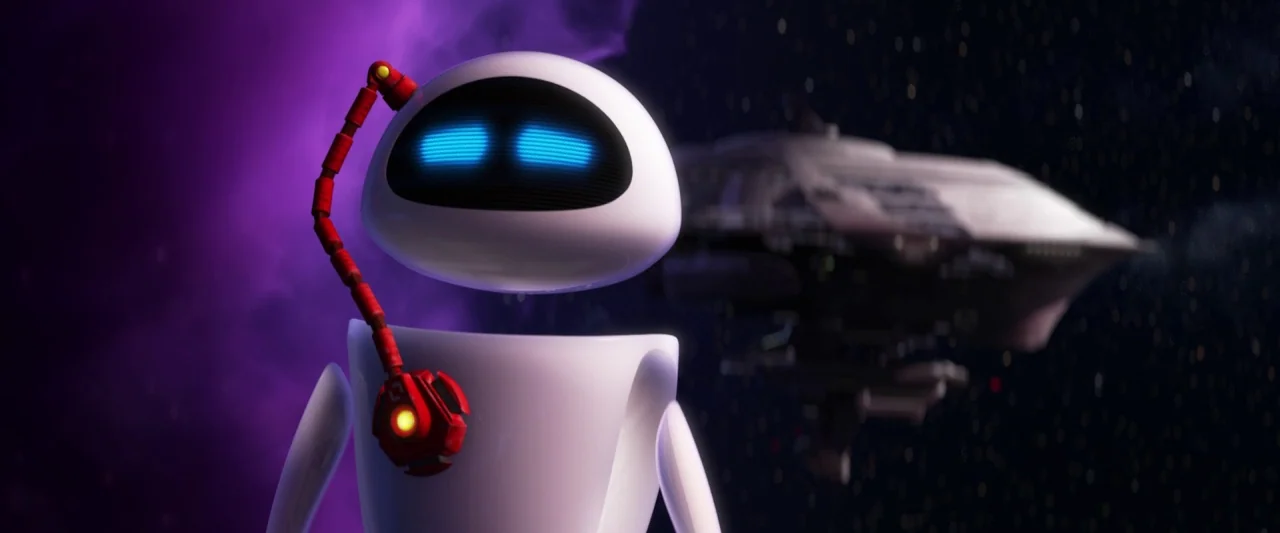 Wall-E (2008) movie still: closeup — A white robot with glowing blue eyes floats in the vastness of deep space. A large metallic ship is blurred in…
