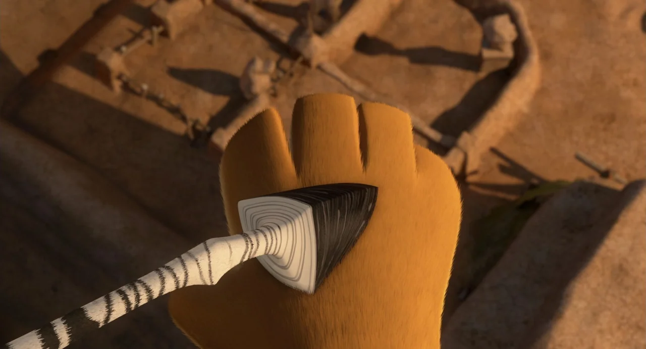 Madagascar 3: Europe's Most Wanted (2012) movie still: closeup — A close view of a textured orange surface with a pointed object. A patterned wooden…