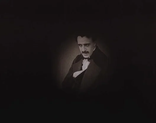 Birth of a Nation (1915) movie still: medium — A man in period clothing is isolated against a solid black background. He poses with one hand tucked…