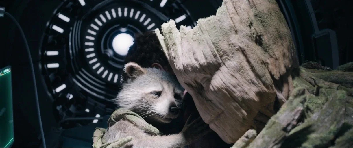 Guardians of the Galaxy Vol. 3 (2023) movie still: closeup — A dark, technological chamber inside a spacecraft features a circular metallic portal…