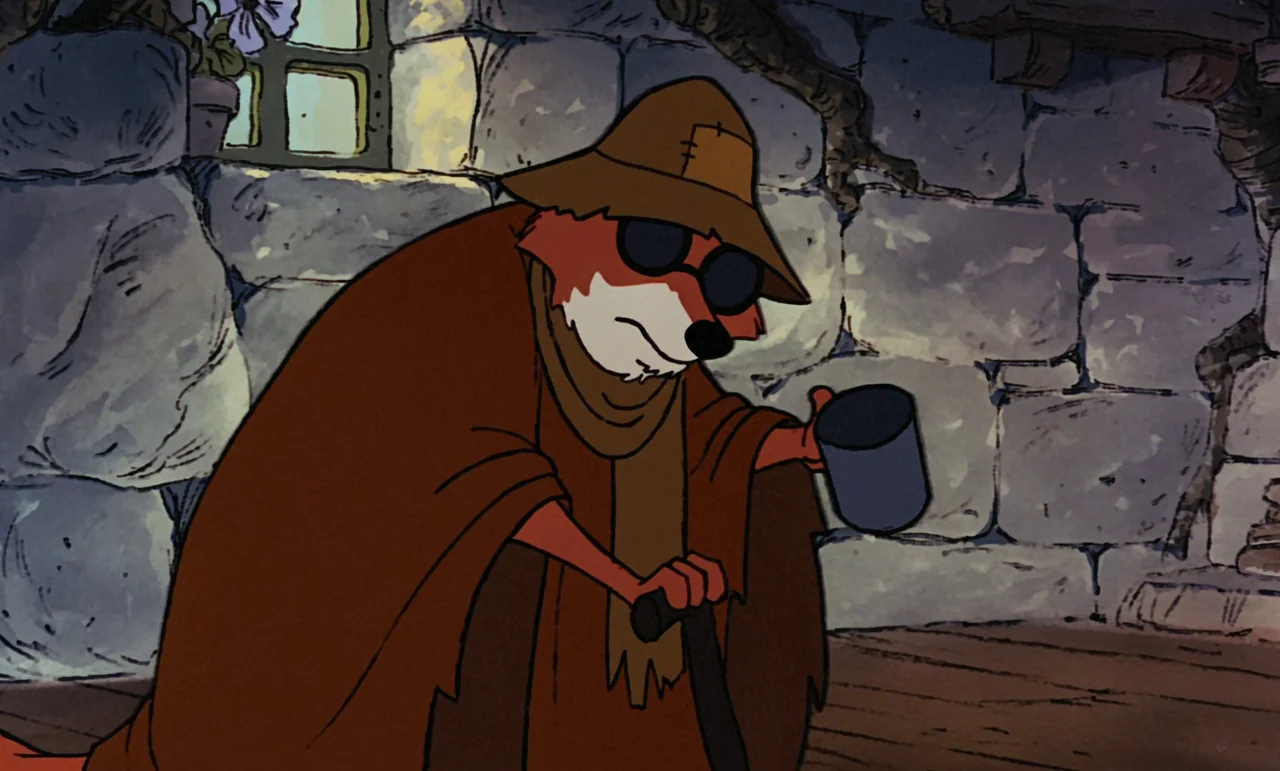 Robin Hood (1973) movie still: medium — A rustic dungeon interior features rough-hewn stone walls and a small barred window. An elderly fox in a…