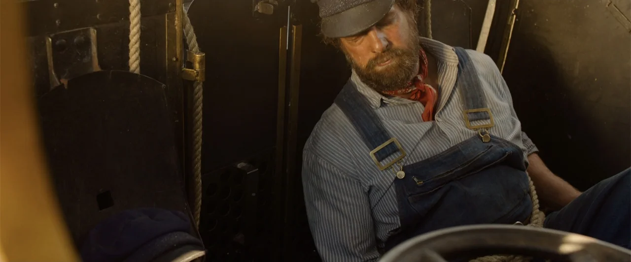 Jim Button and Luke the Engine Driver (2018) movie still: medium — A metallic interior of a mechanical locomotive cab features exposed pipes and…