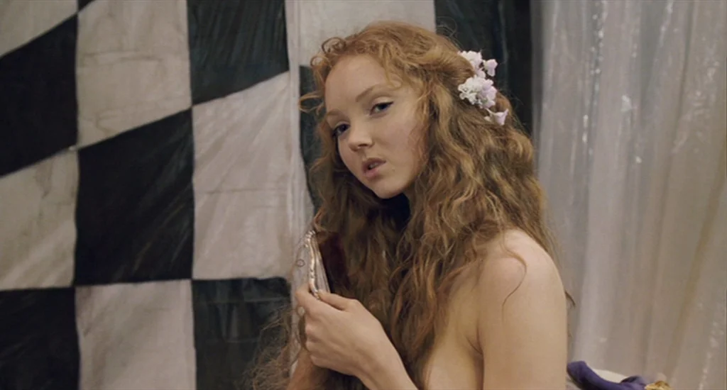 The Imaginarium of Doctor Parnassus (2009) movie still: medium — A dressing room area with a black and white checkerboard wall covering backdrop. A…