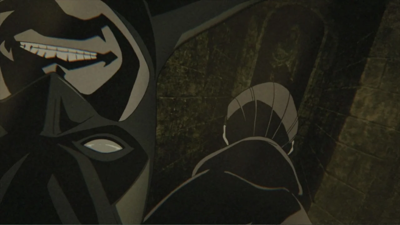 Batman: Gotham Knight (2008) movie still: closeup — A dark, narrow stone corridor features damp walls and arched architectural details. A masked…