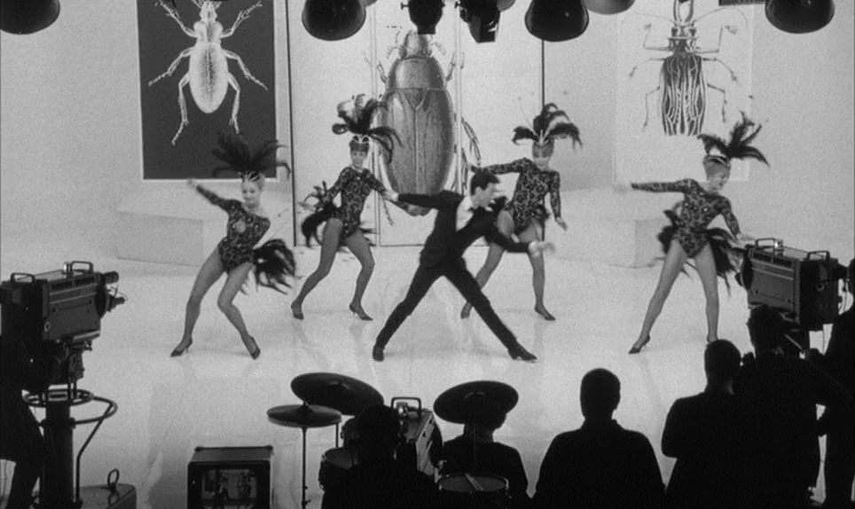 A Hard Days Night (1964) movie still: wide — A bright television studio features four dancers and a male performer on stage. Large framed…
