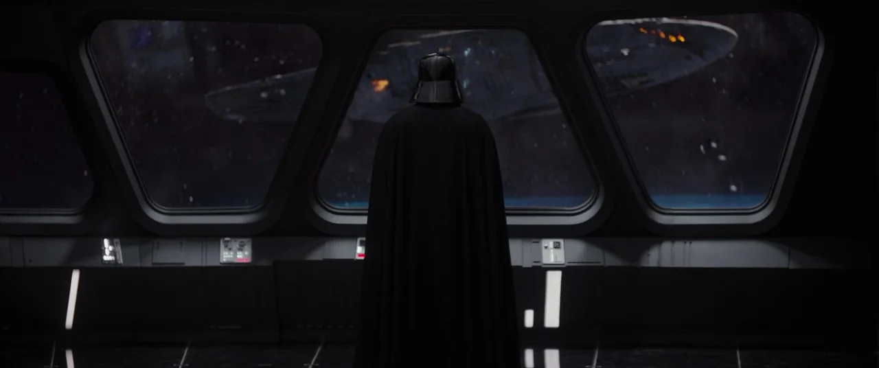 Rogue One: A Star Wars Story (2016) movie still: fullbody — A dark spaceship command bridge with large panoramic windows looking out into deep…