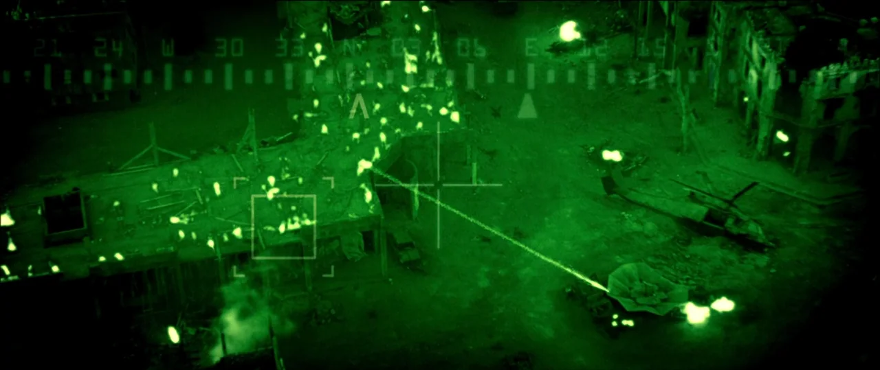 Black Hawk Down (2001) movie still: establishing — A destroyed urban landscape viewed through a monochromatic green night vision targeting system. A…