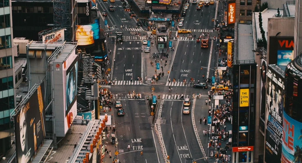 It’s Kind Of A Funny Story (2010) movie still: establishing — An aerial view of a busy city intersection bordered by towering buildings with…