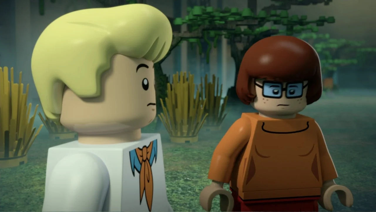 LEGO Scooby-Doo! Haunted Hollywood (2016) movie still: medium — A misty outdoor location with dense foliage and blocky, constructed-looking trees.…