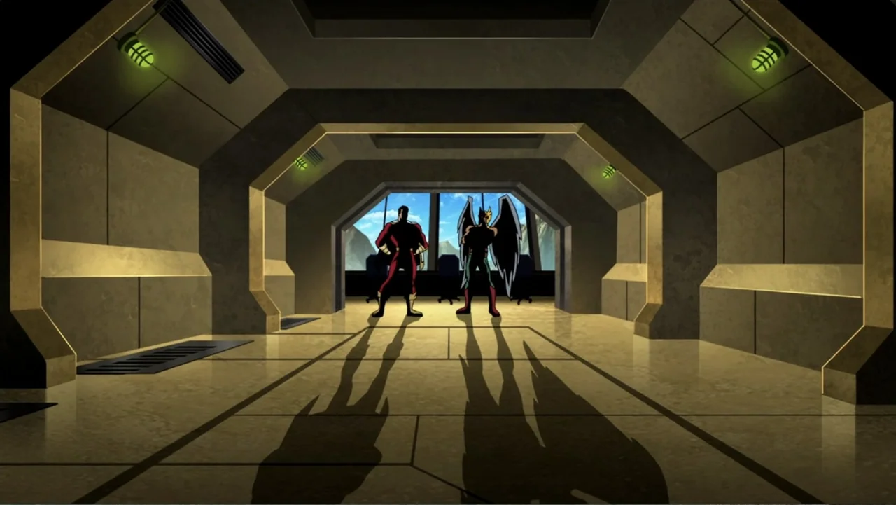 Superman/Batman: Public Enemies (2009) movie still: wide — A metallic, geometric corridor features recessed lighting and a large window looking onto…