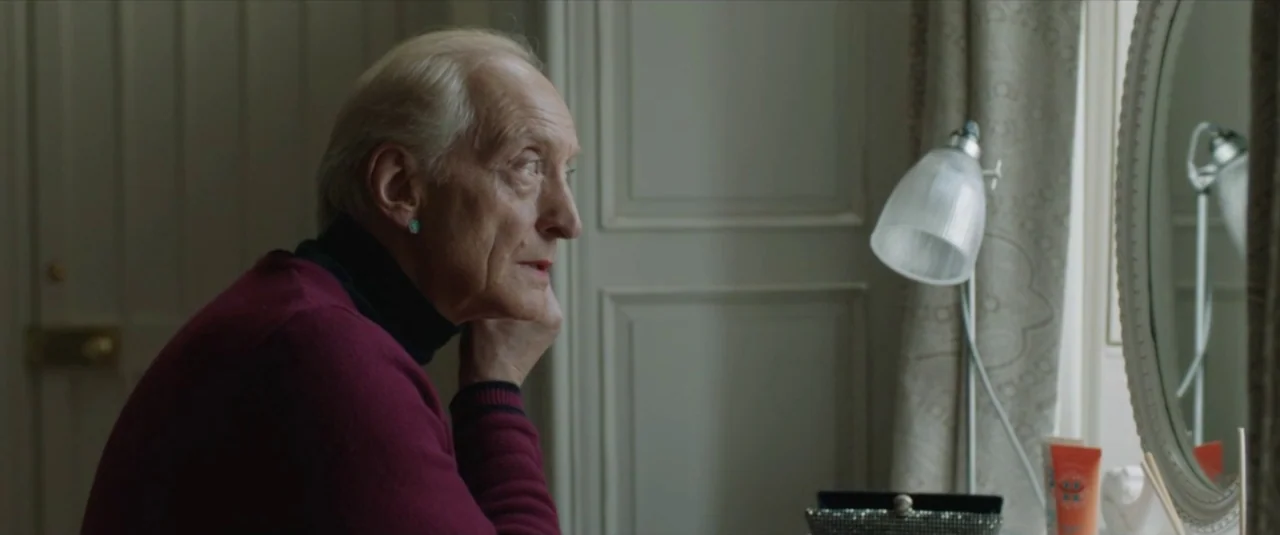 Happy New Year, Colin Burstead (2018) movie still: medium — An interior space features a vanity setup with a lamp near a window. An elderly man with…