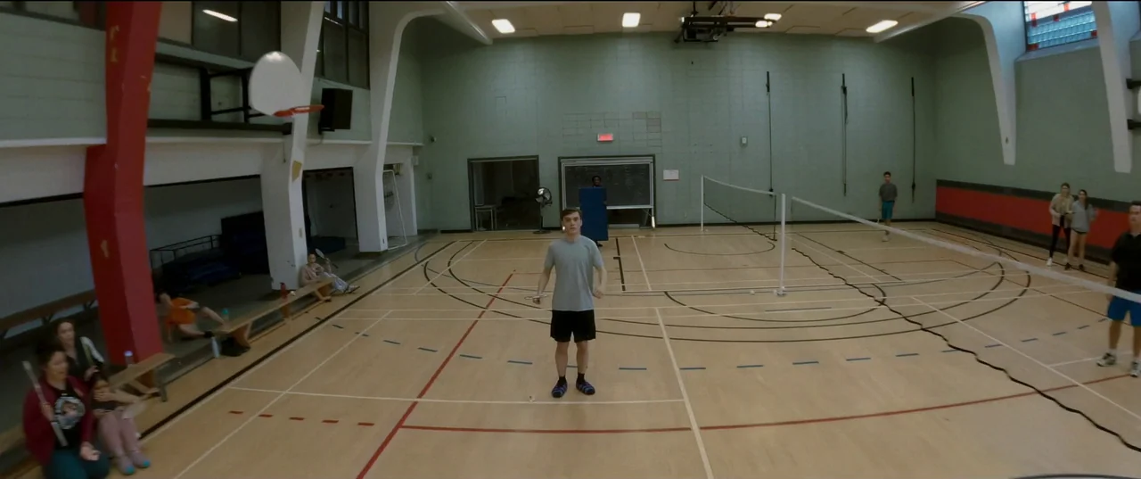 Humanist Vampire Seeking Consenting Suicidal Person (2023) movie still: wide — A spacious high-school style gymnasium features painted court lines…