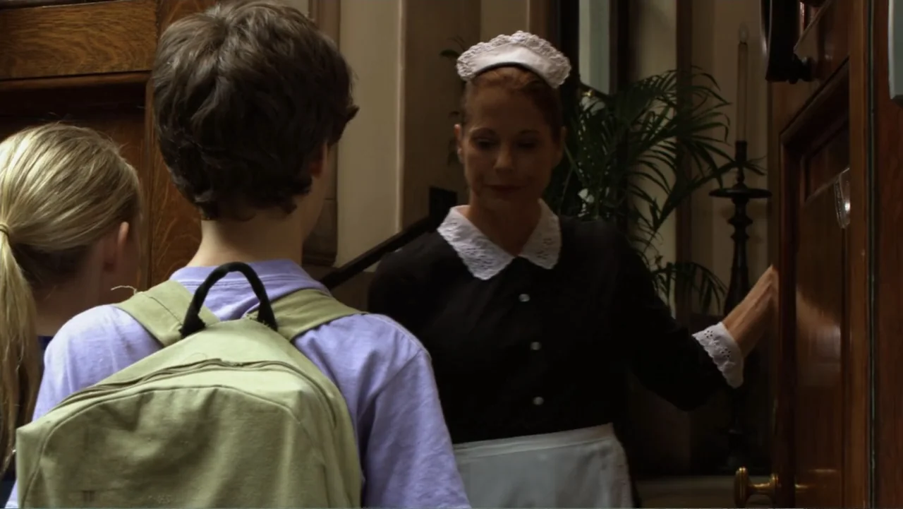 Jeremy Fink and the Meaning of Life (2012) movie still: medium — A classic residential foyer features a dark wood door and architectural molding. A…