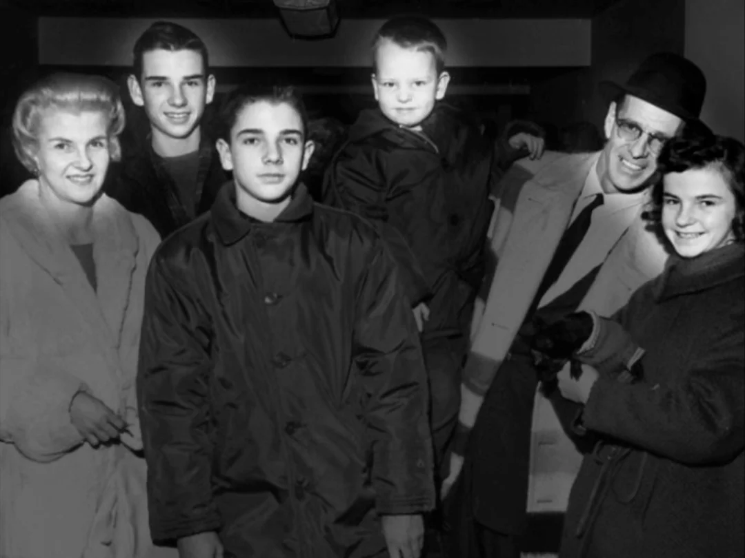 My Winnipeg (2007) movie still: medium — A group of six people stand close together for a portrait in a dark interior. The subjects wear 1950s-style…