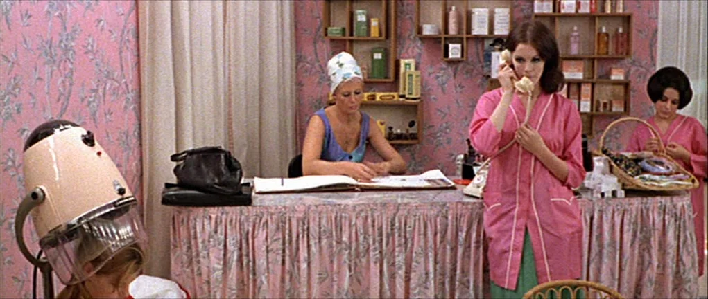 Two or Three Things I Know About Her (2 ou 3 choses que je sais d’elle) (1967) movie still: medium — A beauty salon features pink floral wallpaper…
