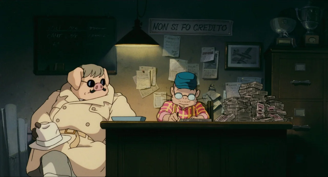 Porco Rosso (1992) movie still: medium — A cluttered, dimly lit office featuring a sign on the wall reading non si fo credito. A man sits at a desk…