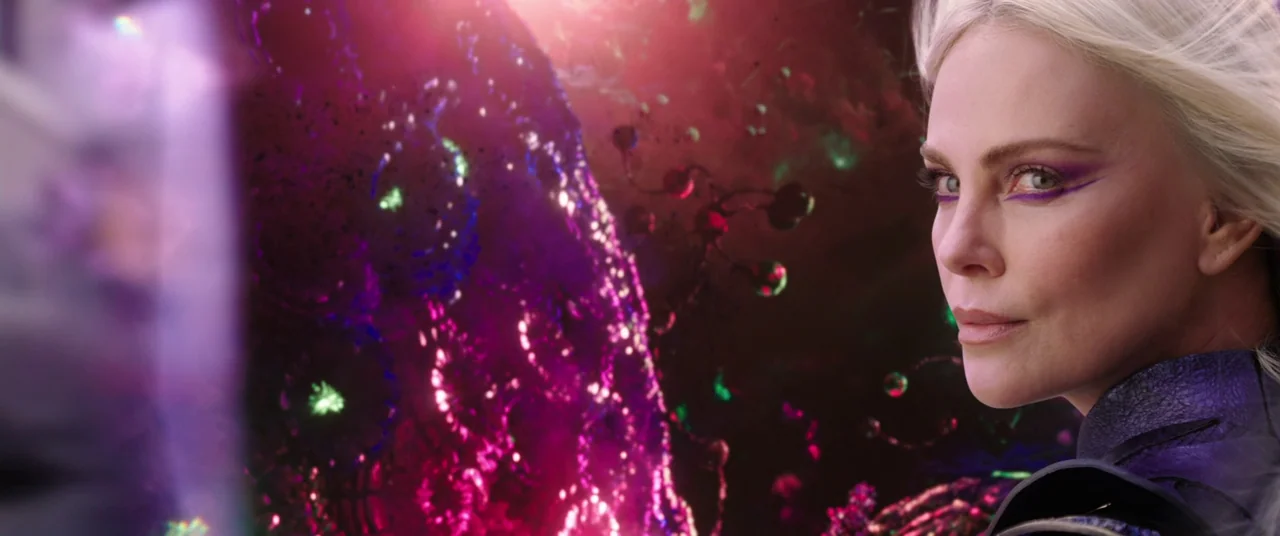 Doctor Strange in the Multiverse of Madness (2022) movie still: closeup — A dark cosmic rift filled with glowing purple and green energy particles.…