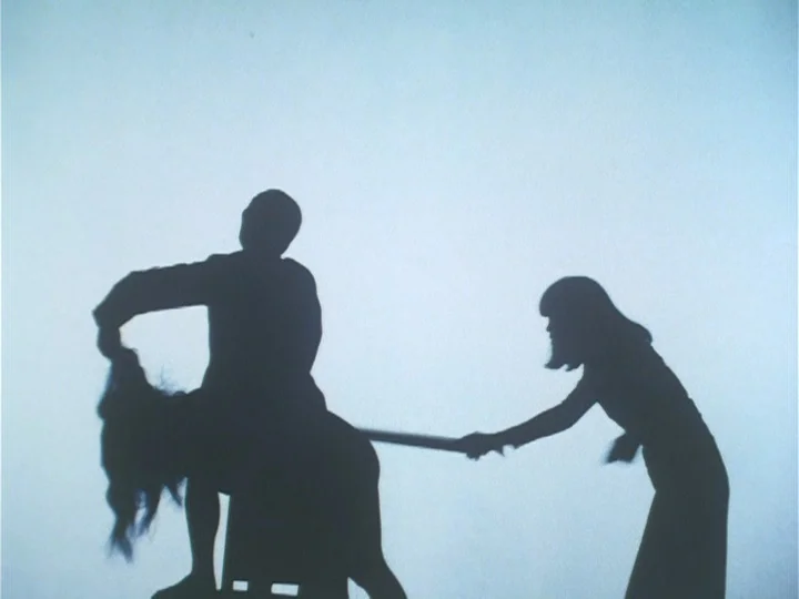 Butterfly (1974) movie still: medium — A plain brightly lit interior space with no visible furniture except a small stool. Three silhouetted figures…