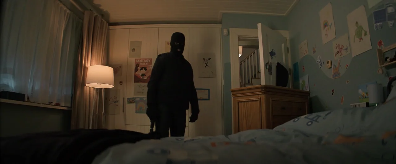 Drop (2025) movie still: fullbody — A child's bedroom features blue walls decorated with colorful drawings and a white wardrobe. An intruder wearing…