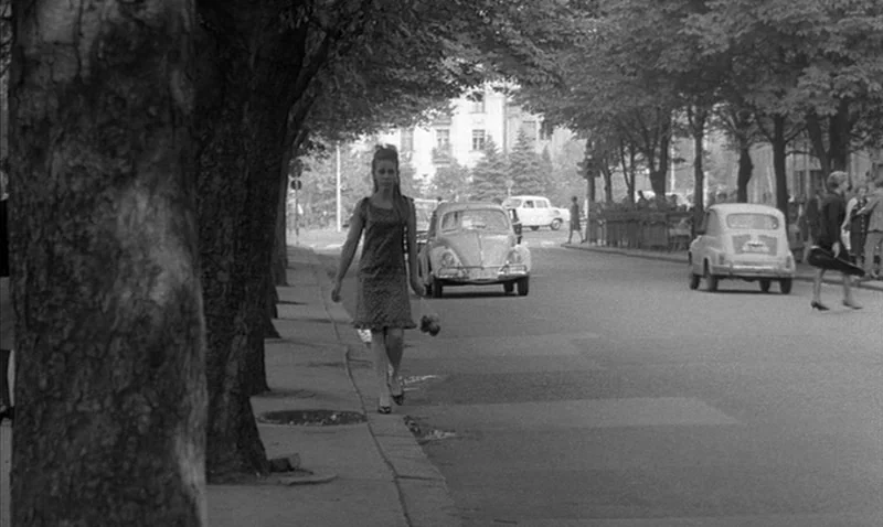 Love Affair, or the Case of the Missing Switchboard Operator (1967) movie still: fullbody — A tree-lined city boulevard with cars parked along the…