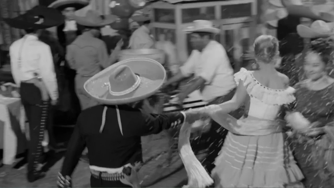Escuela para solteras (1965) movie still: medium — A festive outdoor gathering features several people dressed in traditional outfits during a…
