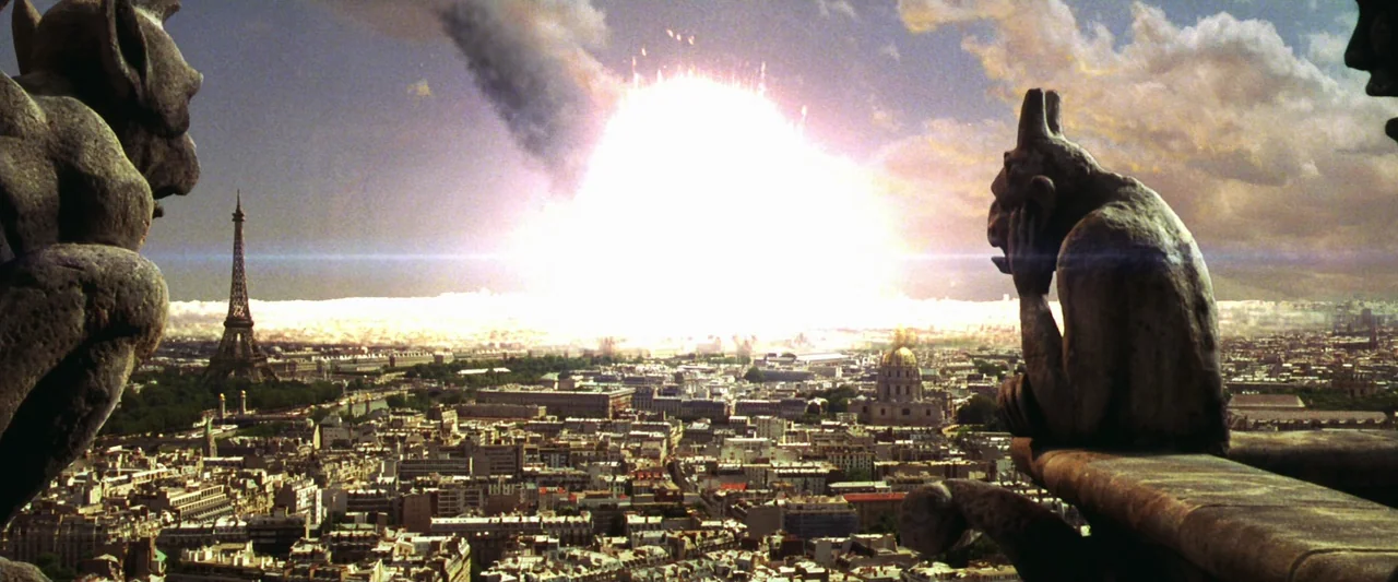 Armageddon (1998) movie still: wide — A stone gargoyle sits on a cathedral ledge overlooking a densely populated urban sprawl. A massive white…