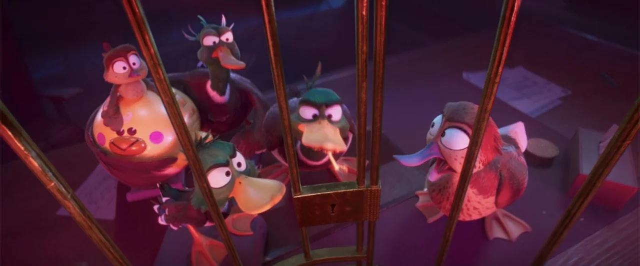 Migration (2023) movie still: medium — A group of stylized animated ducks stand behind vertical metal bars in a dark room. The ducks look forward…