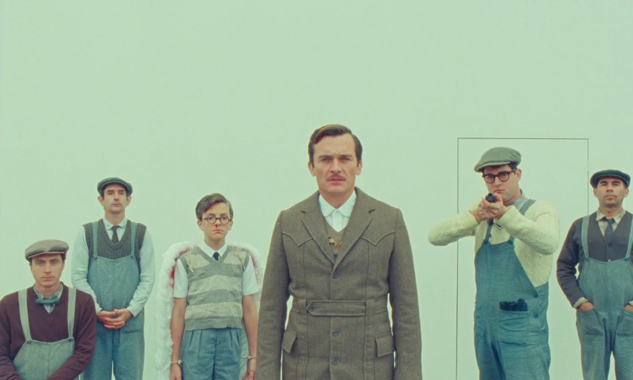 The Swan (2023) movie still: fullbody — Five men are positioned in a stark, minimalist white room with solid walls. The central figure faces the…