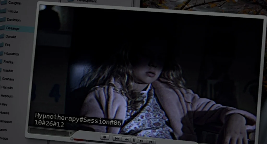 Mama (2013) movie still: medium — A computer screen displays a video file titled Hypnotherapy Session 06 with a digital interface. A young woman…