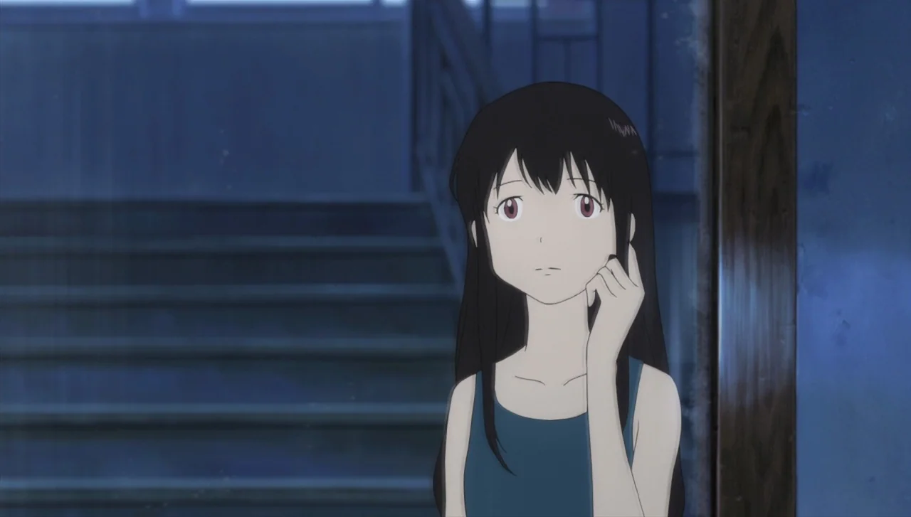 Wolf Children (2012) movie still: medium — A dark staircase interior is visible behind the girl. The young girl stands in the foreground with her…