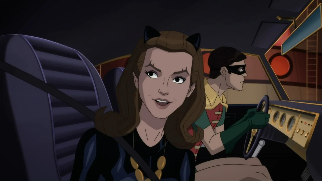 Batman: Return of the Caped Crusaders (2016) movie still: medium — The interior of a vintage-style vehicle features a gold-trimmed dashboard and…