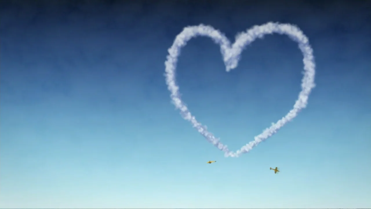 When Strangers Click: Five Stories from the Internet (2011) movie still: establishing — A clear blue sky displays a large heart shape formed by…