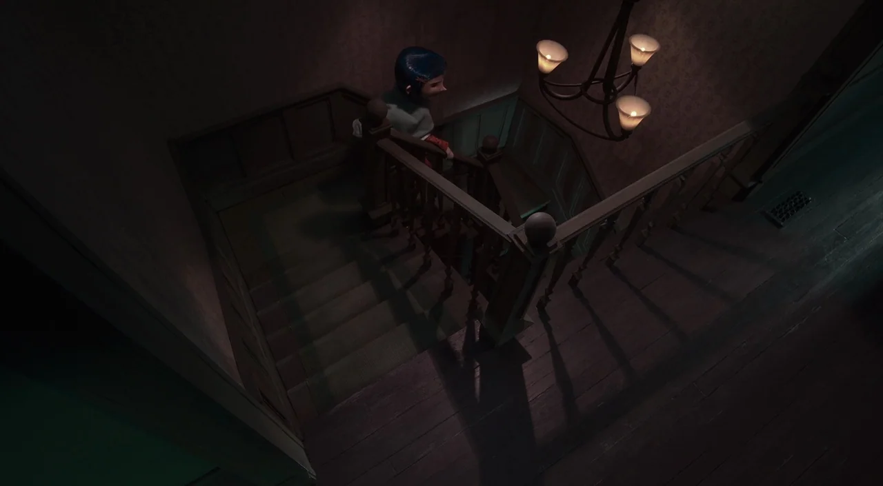 Coraline (2009) movie still: wide — A dimly lit staircase features dark wood paneling and vintage floral wallpaper. A child with short blue hair…