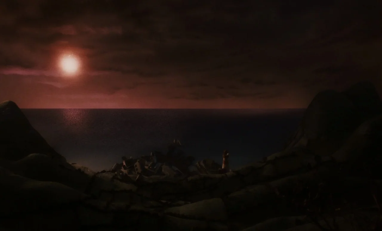 James and the Giant Peach (1996) movie still: establishing — A dark, hilly coastal landscape overlooks a small village by the sea at night. A bright…