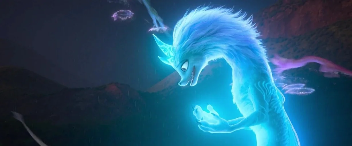 Raya and the Last Dragon (2021) movie still: medium — A glowing blue dragon-like creature stands in a dark, mountainous night environment during…