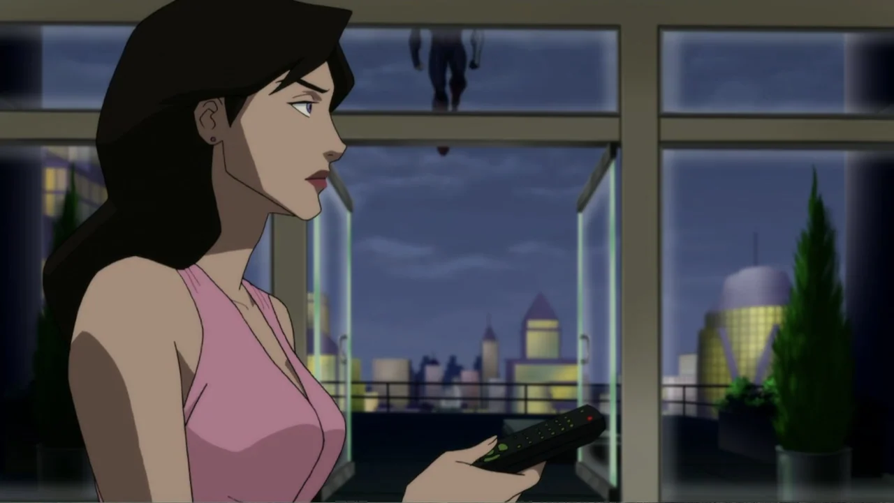 Reign of the Supermen (2019) movie still: medium — A woman stands in a modern apartment looking through an open sliding glass door. A person is…