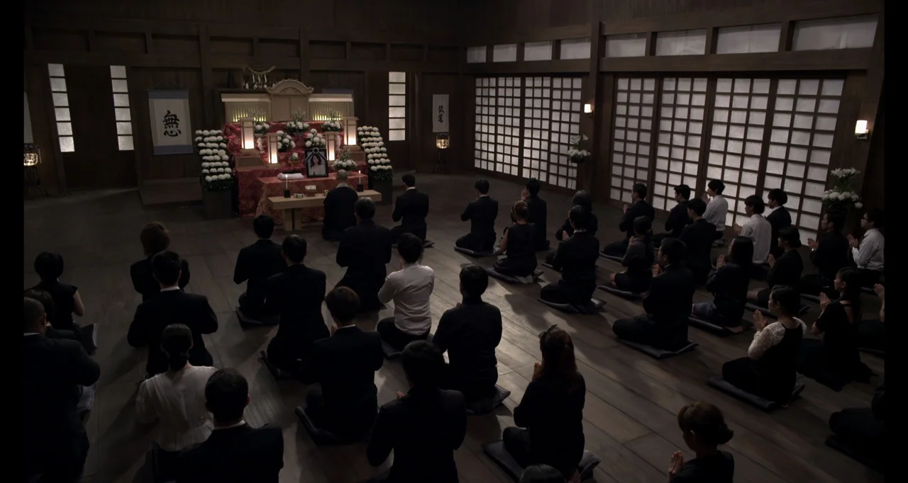 Ninja: Shadow of a Tear (2013) movie still: wide — A wooden ceremonial hall features shoji screens along the walls and a central altar. Many people…