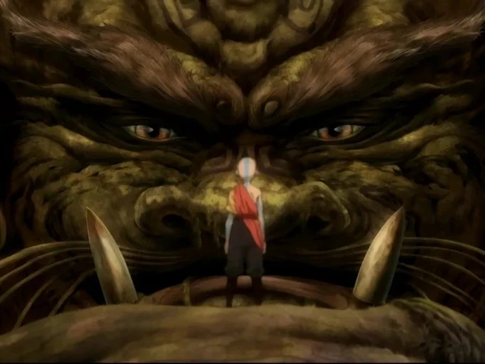 Avatar: The Last Airbender (2005) movie still: wide — A colossal stone lion turtle face is carved directly into a mountain cliffside. A small monk…