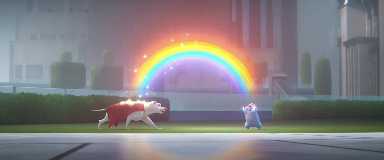 DC League of Super-Pets (2022) movie still: medium — A well-manicured lawn with groomed hedges serves as the setting in a city park. A white dog…