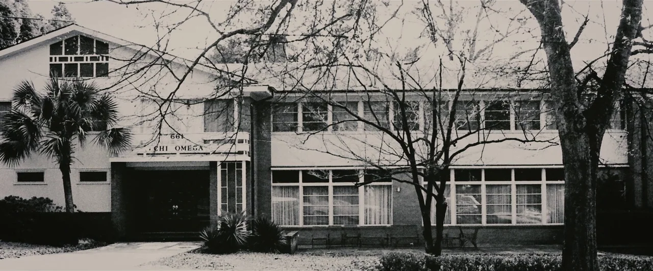 Extremely Wicked, Shockingly Evil and Vile (2019) movie still: establishing — A two-story mid-century building features brick masonry and large…