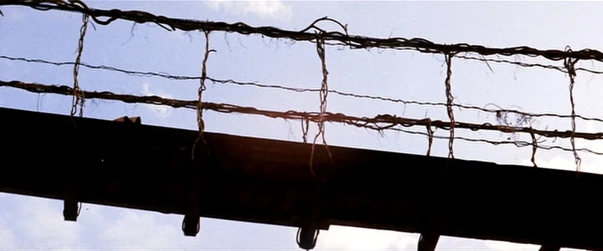 Lone Wolf and Cub: Sword of Vengeance (1972) movie still: closeup — A close-up view of a rustic, hand-built suspension bridge made of rough-hewn…