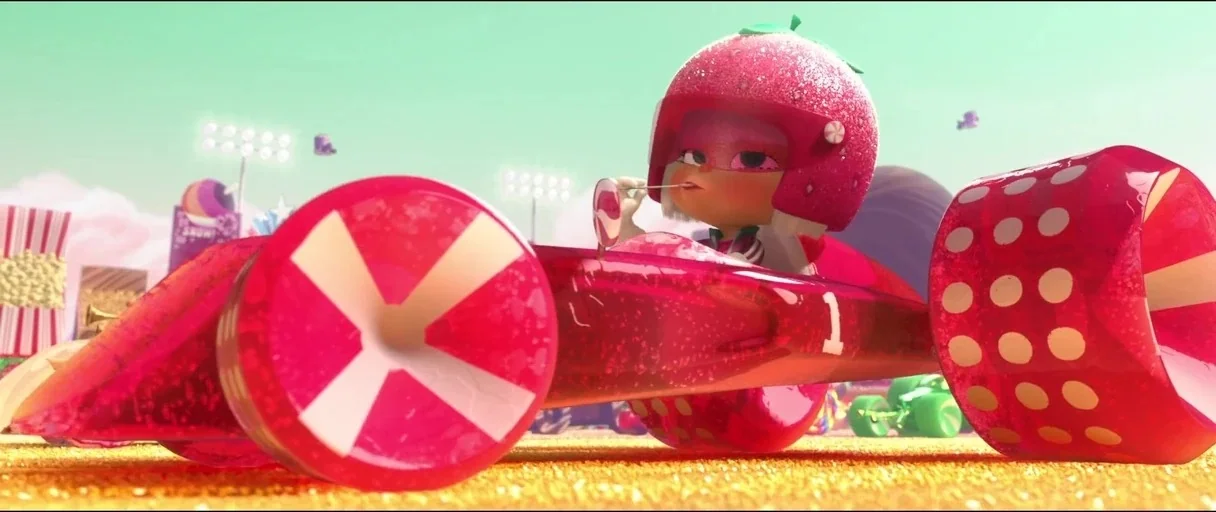Wreck-It Ralph (2012) movie still: medium — A candy-themed racetrack featuring a brightly colored, translucent racecar made of gel-like materials. A…