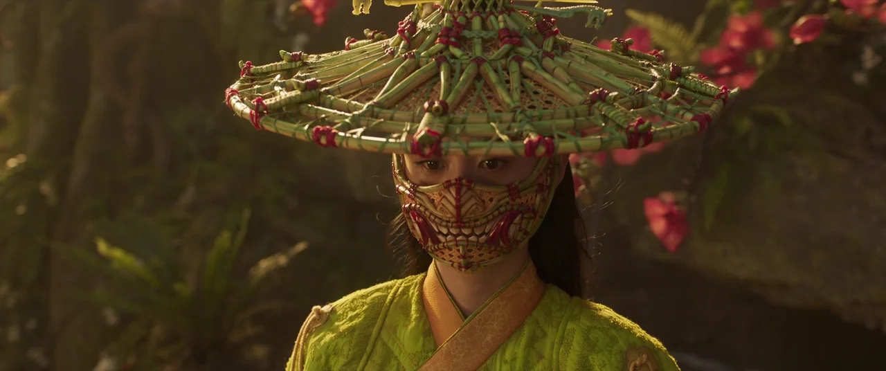 Shang-Chi and the Legend of the Ten Rings (2021) movie still: medium — A lush tropical jungle environment with visible pink blossoms and foliage in…