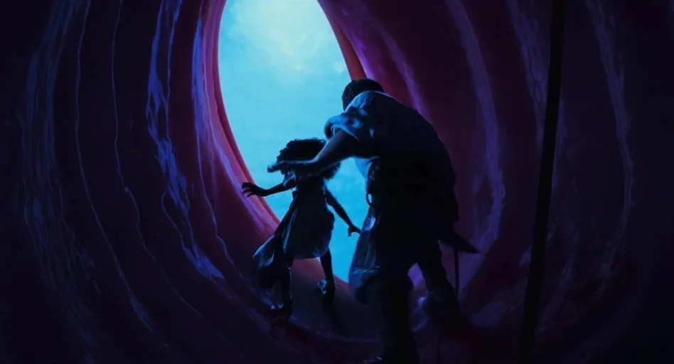 The Sea Beast (2022) movie still: fullbody — The characters stand inside a smooth, curved passage resembling a giant internal organ. They move…