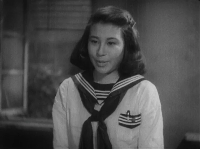 Drunken Angel (1948) movie still: medium — A Japanese school room interior with a window featuring horizontal blinds in the background. A young…