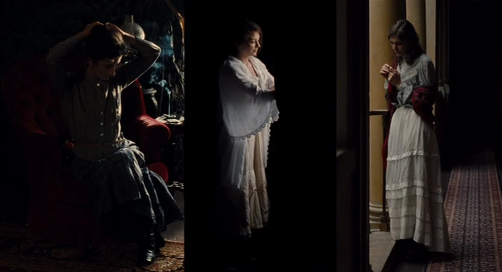House of Tolerance (2011) movie still: fullbody — A dark, elegant corridor with columns and a patterned runner rug underfoot. A young woman in a…