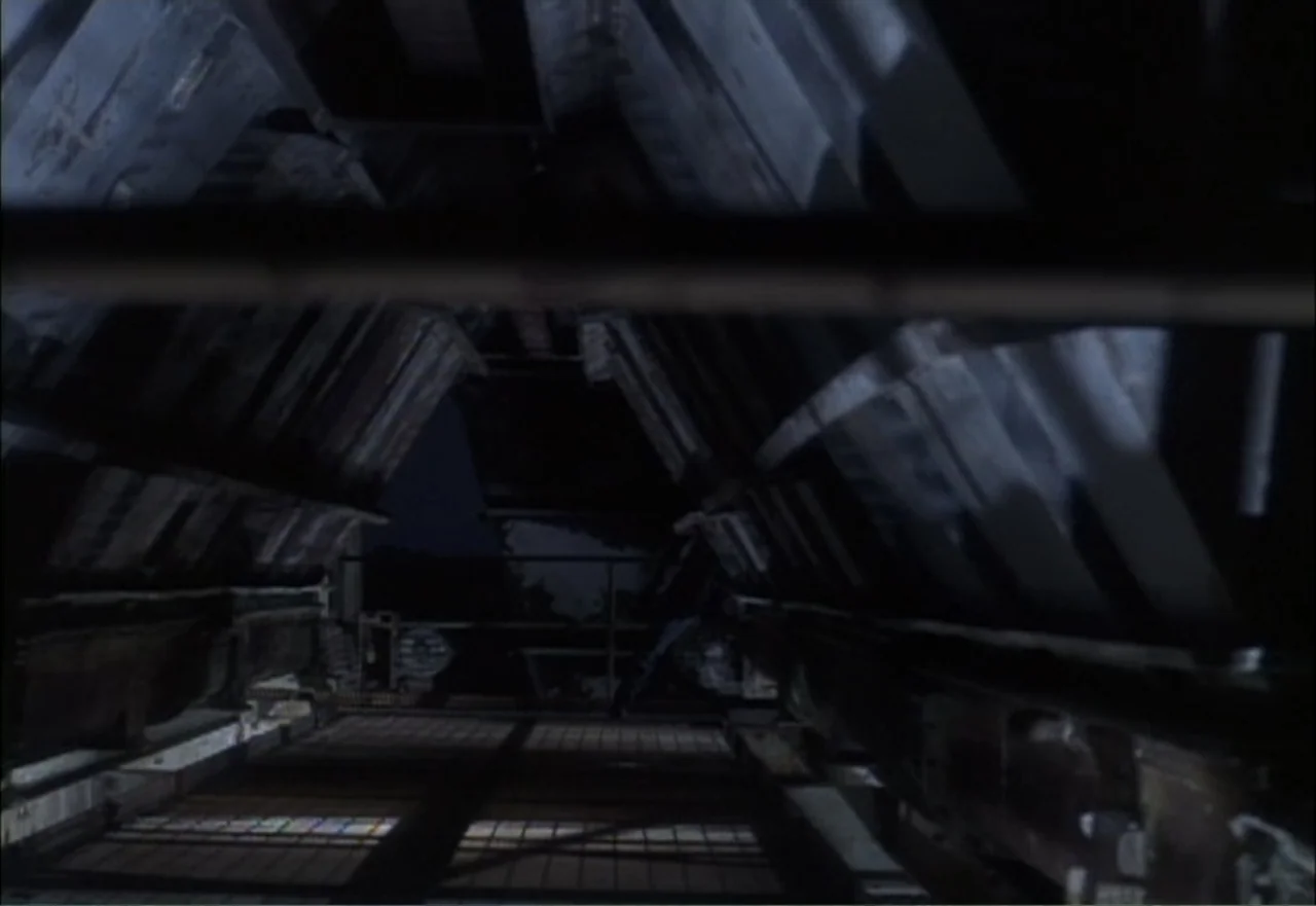 Ambushed (1998) movie still: establishing — An industrial attic space features dark wooden beams and a narrow central floor.