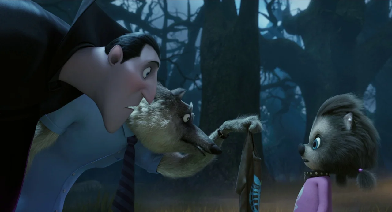 Hotel Transylvania movie still: medium — A dark, misty woodland area with silhouettes of twisted, leafless trees at night. A vampire and a werewolf…