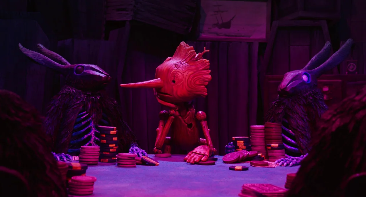 Guillermo del Toro’s Pinocchio (2022) movie still: medium — A dimly lit room with dark wooden walls and framed artwork in the background. A wooden…